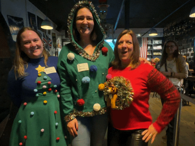 Three women in festive Christmas gear