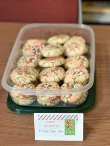 Container of Earl Grey Tea Sugar Cookies with red, white and green sprinkles